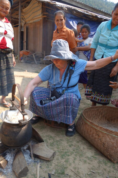 Learning how to reel silk in Laos