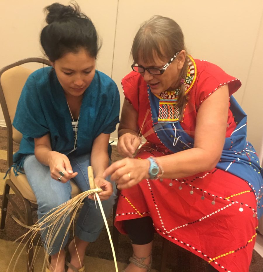 2019 Scholarship Alice Brown Memorial Scholarship Recipient Mari Gray learning Palm Basket Weaving from meeting presenter Laura Lemunyete