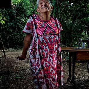 Eric Mindling caught this beautiful woman in her Scarab Beetle Tree Huipil, for his book Oaxacan Stories in Cloth.